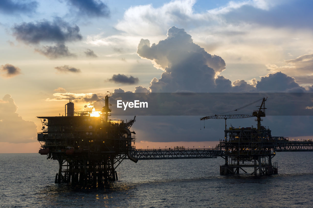 Silhouette of an oi production platform during sunset at offshore terengganu oil field