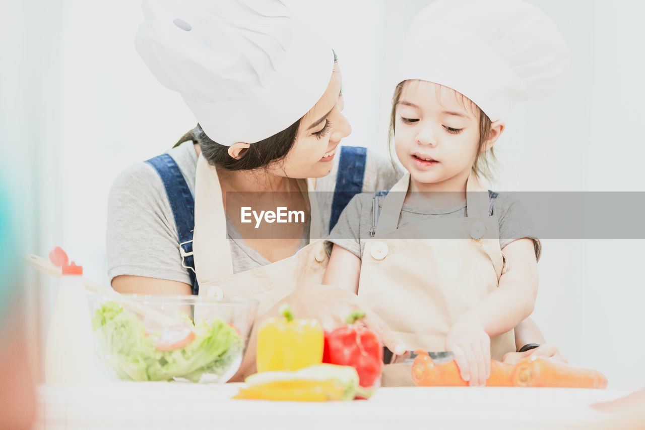 TWO PEOPLE LOOKING AWAY IN PLATE