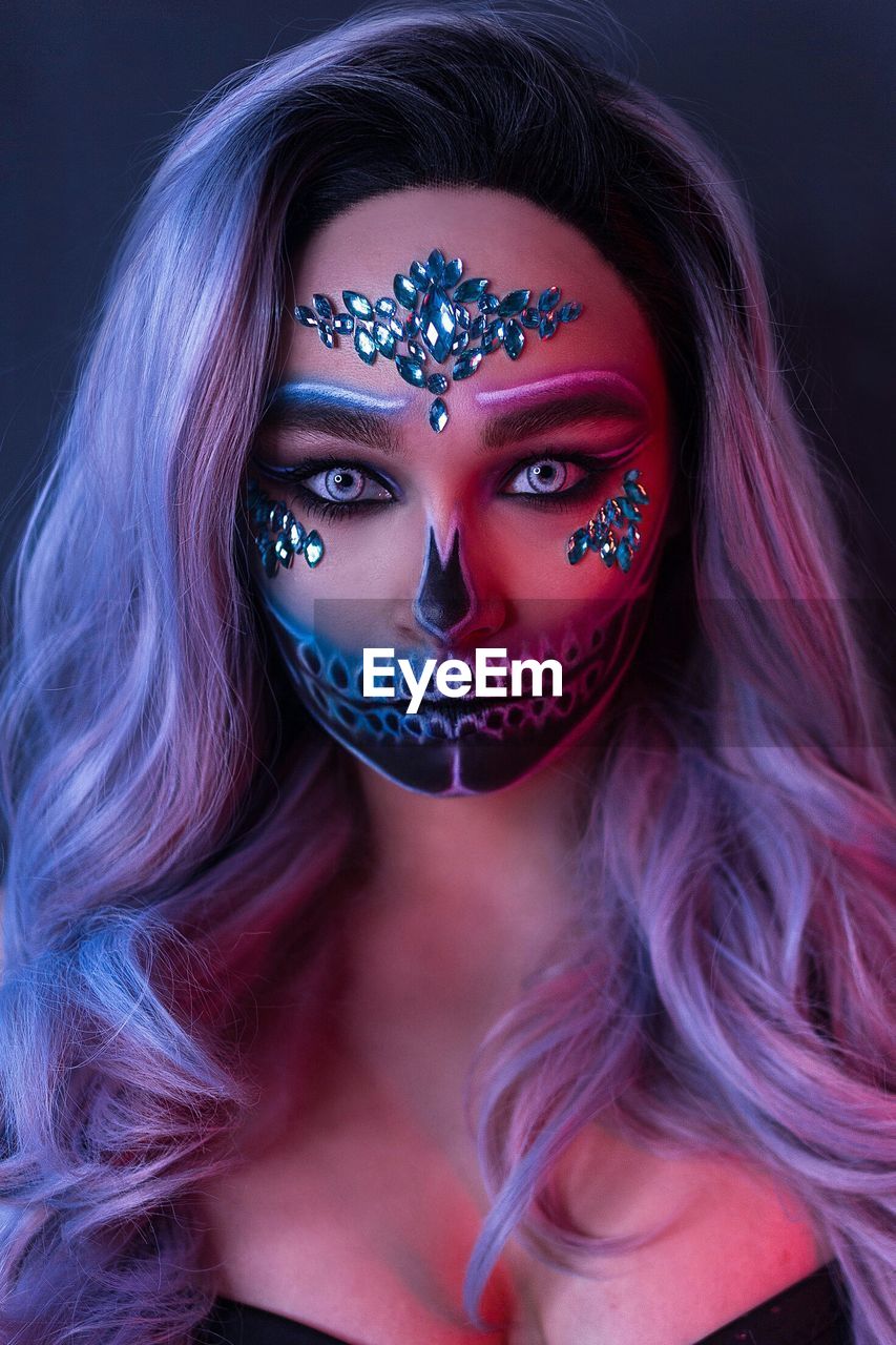 Portrait of woman with face paint