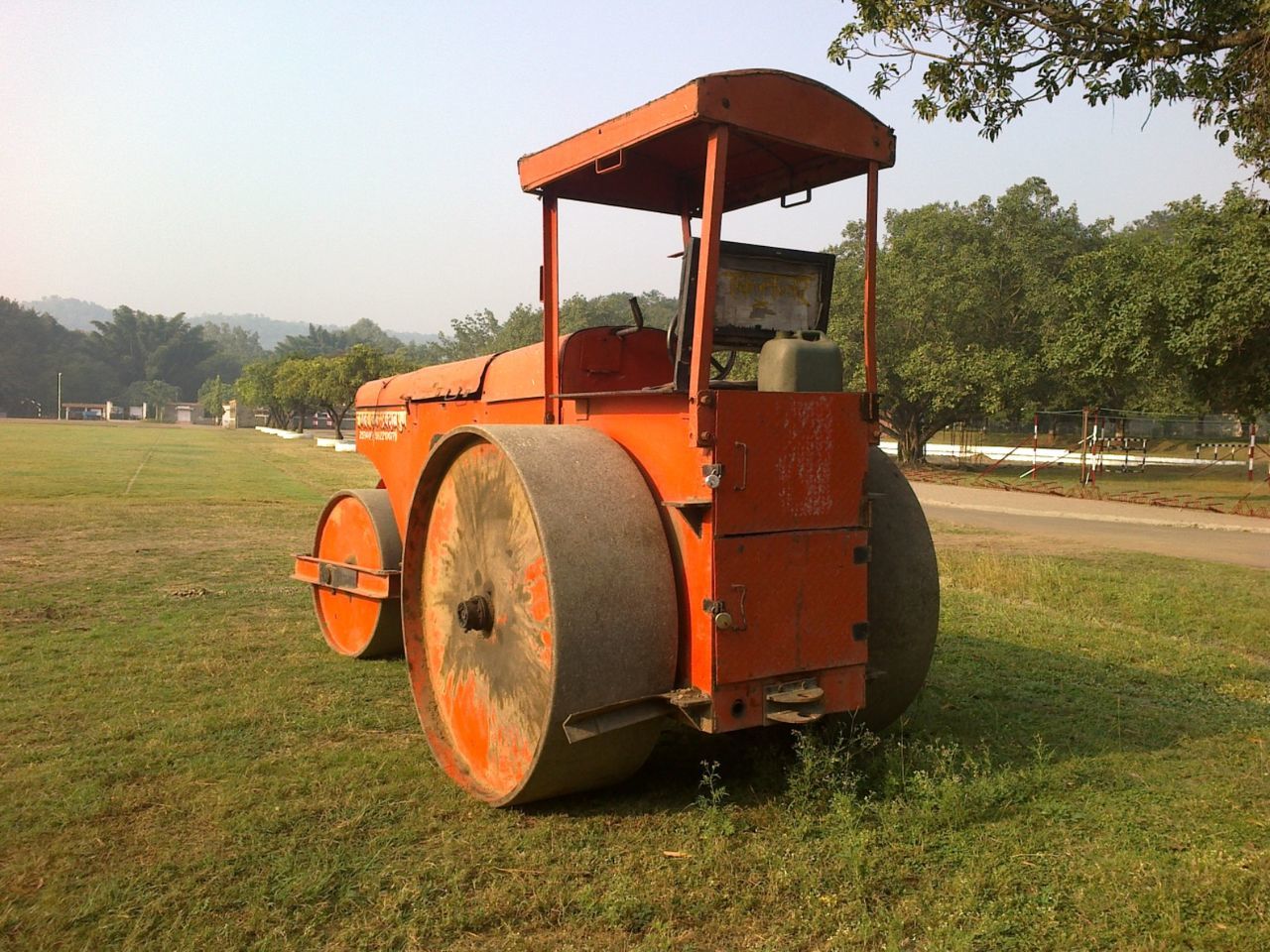 Steamroller on grassy field