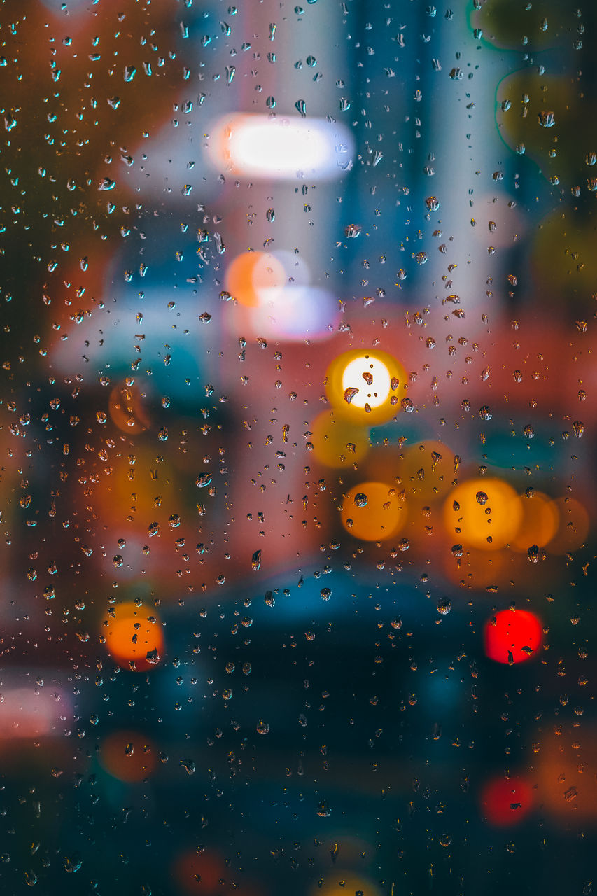 RAIN DROPS ON GLASS WINDOW