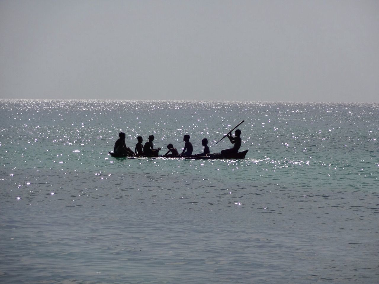 Family in canoe in sea
