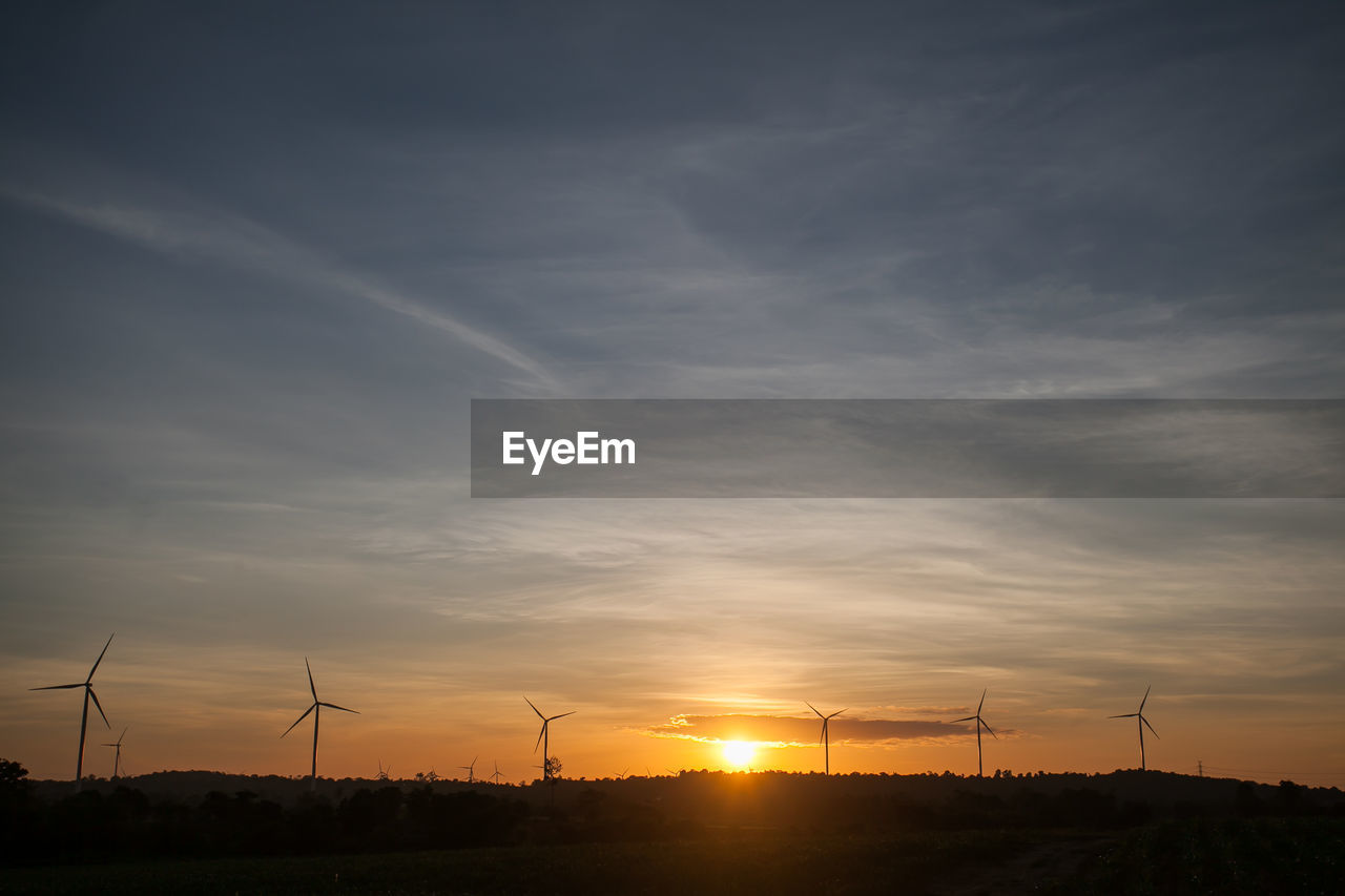 Wind turbine farm at sunset