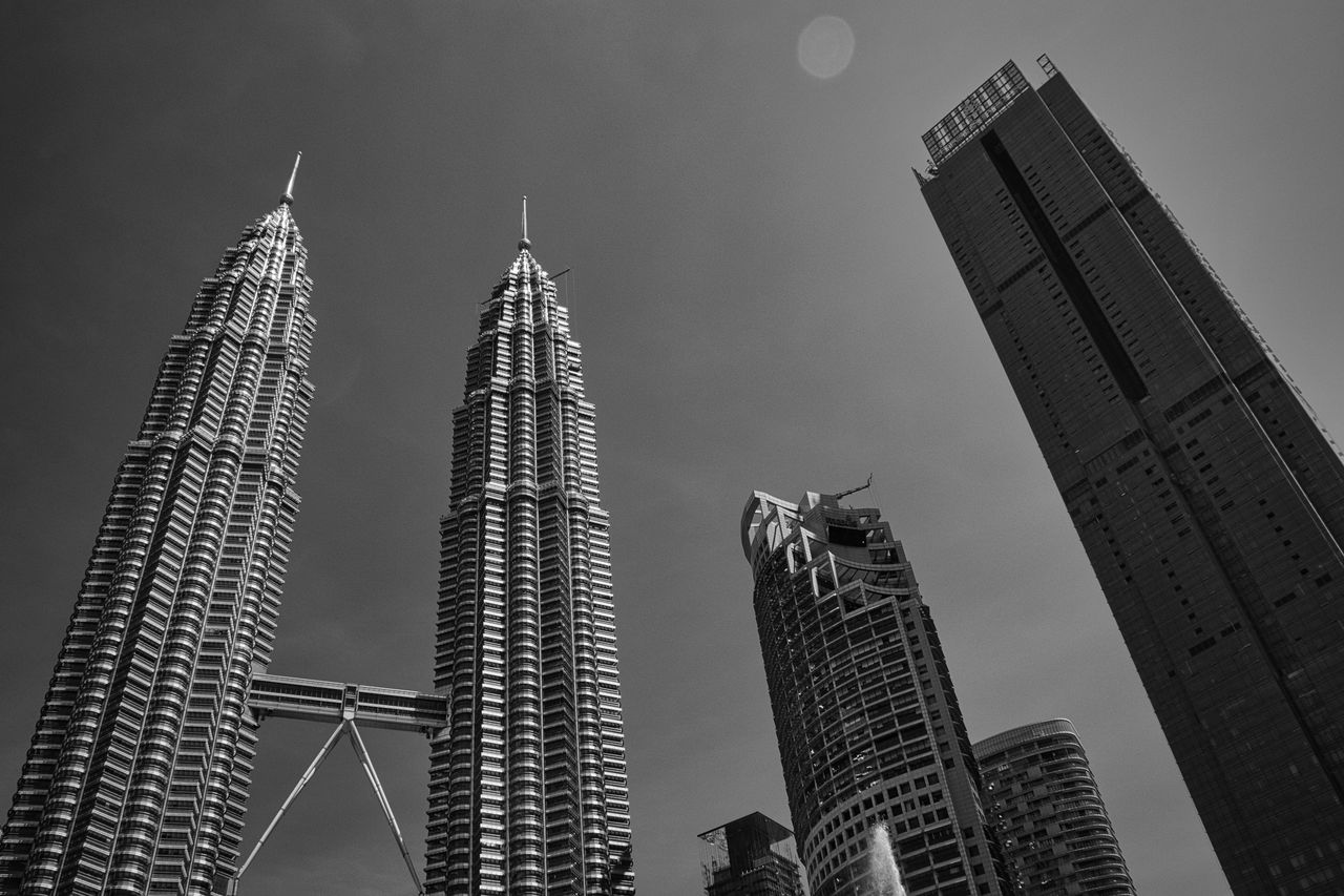 architecture, black and white, built structure, skyscraper, building exterior, office building exterior, city, building, sky, monochrome, monochrome photography, metropolis, skyline, tower block, tower, landscape, metropolitan area, office, travel destinations, nature, urban skyline, no people, low angle view, cityscape, downtown district, business, travel, night, residential district, outdoors, landmark, business finance and industry, finance, development, black, city life