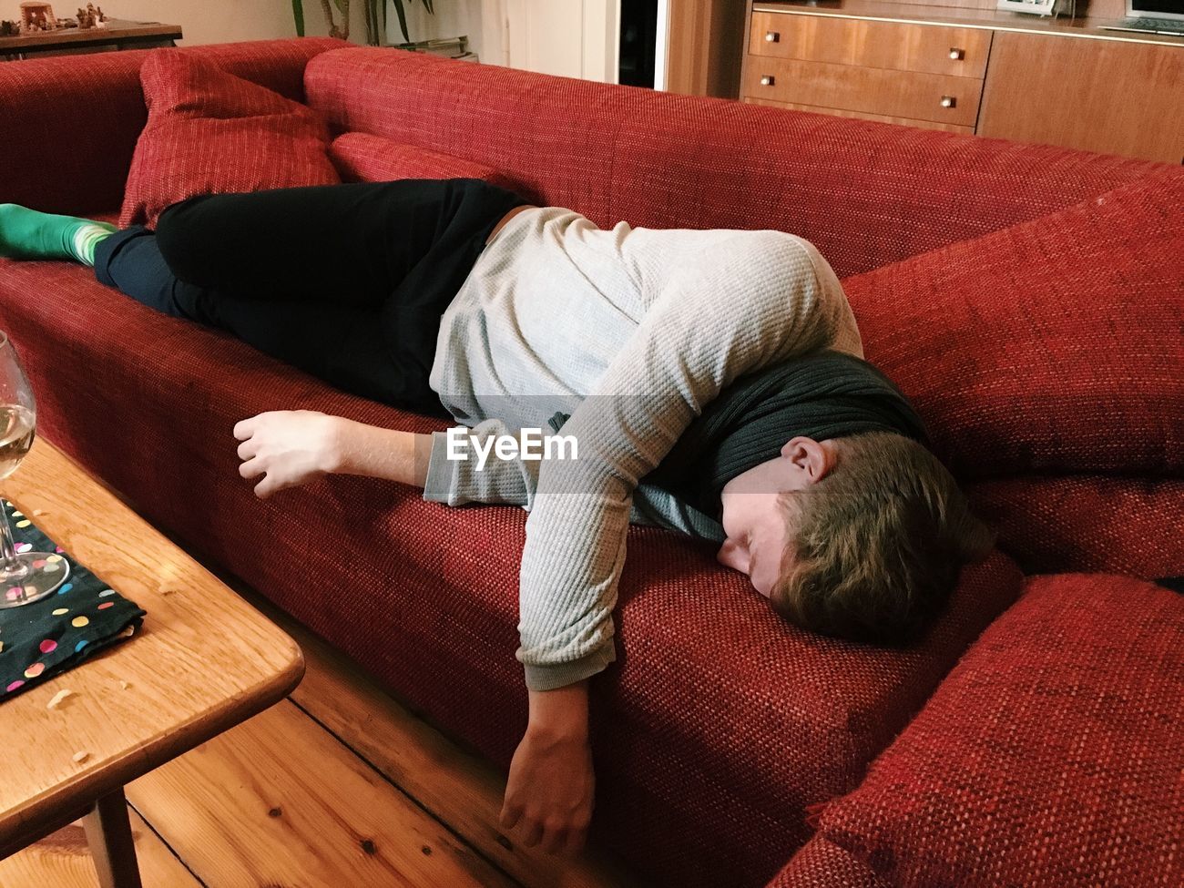 Young Man Sleeping On Sofa At Home Id 77929377