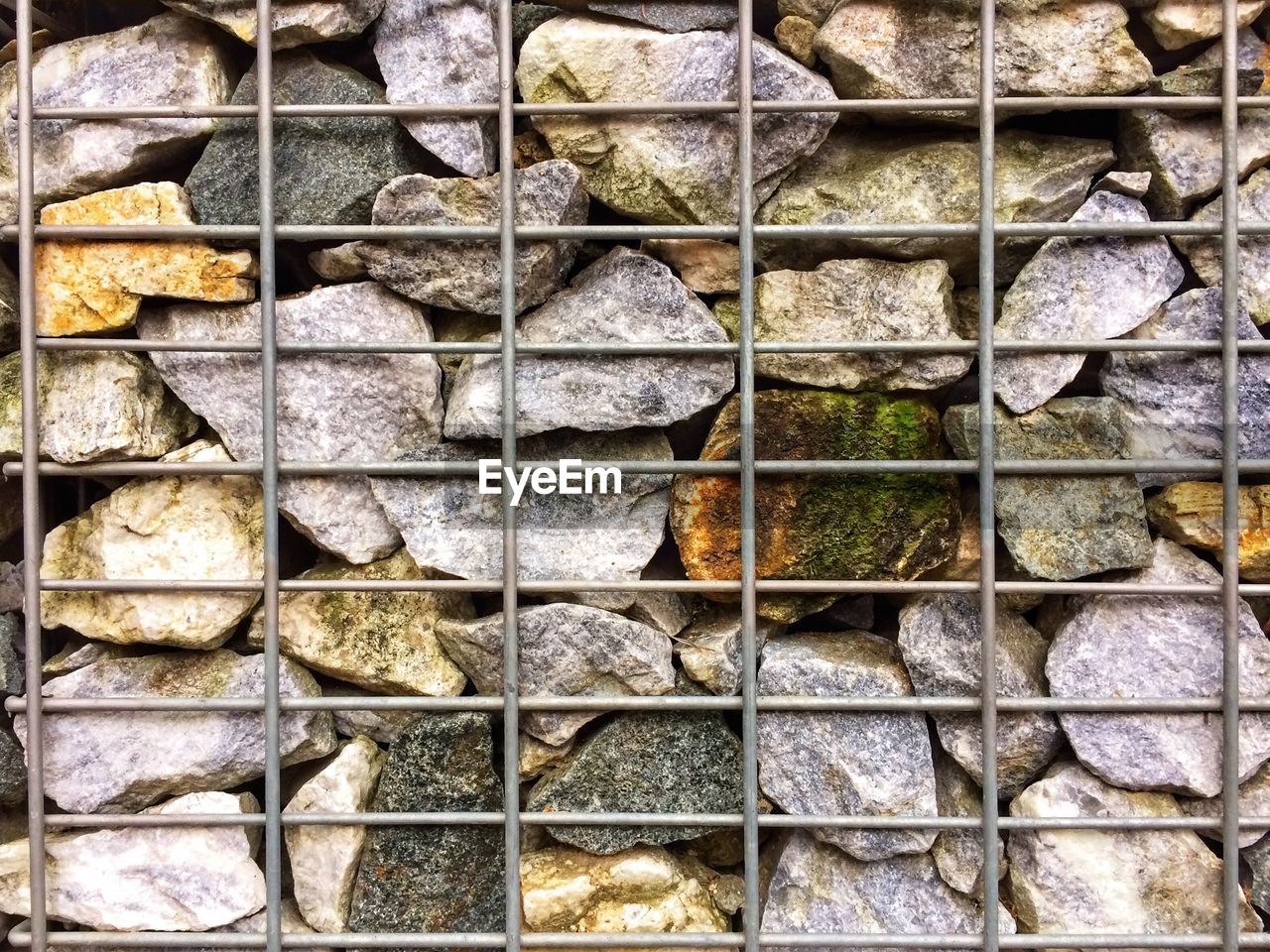 Full frame shot of stones in fence