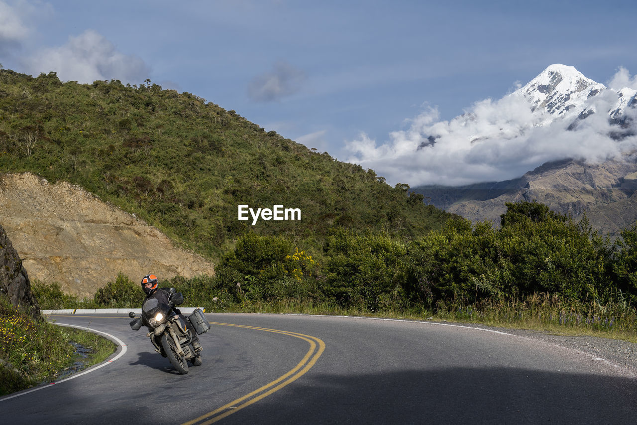 Man driving his touring motorbike down from the abra de malaga pass