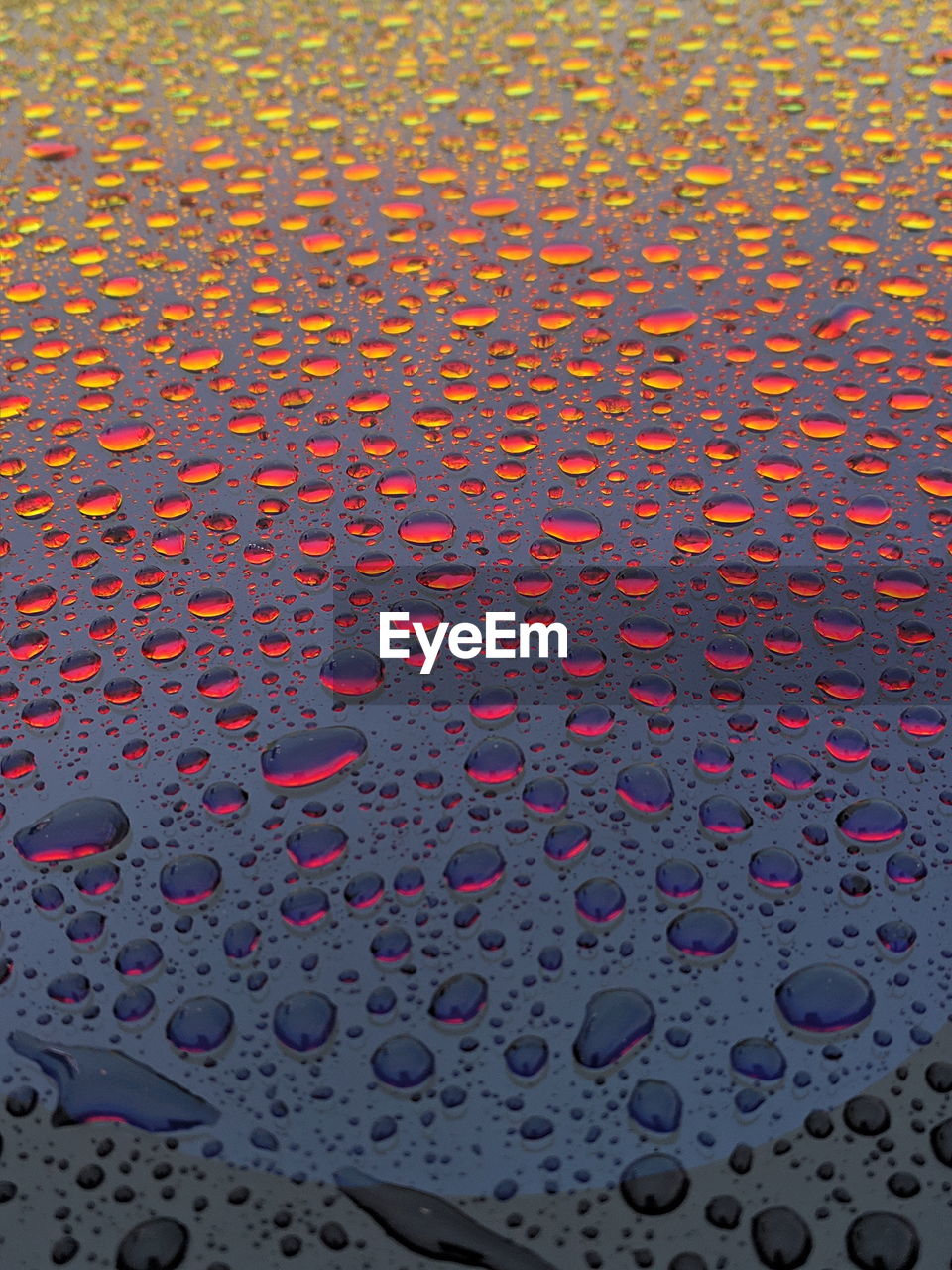 Full frame shot of raindrops on glass window
