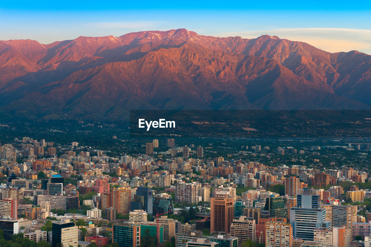 Panoramic view of providencia district with los andes mountain range in santiago de chile
