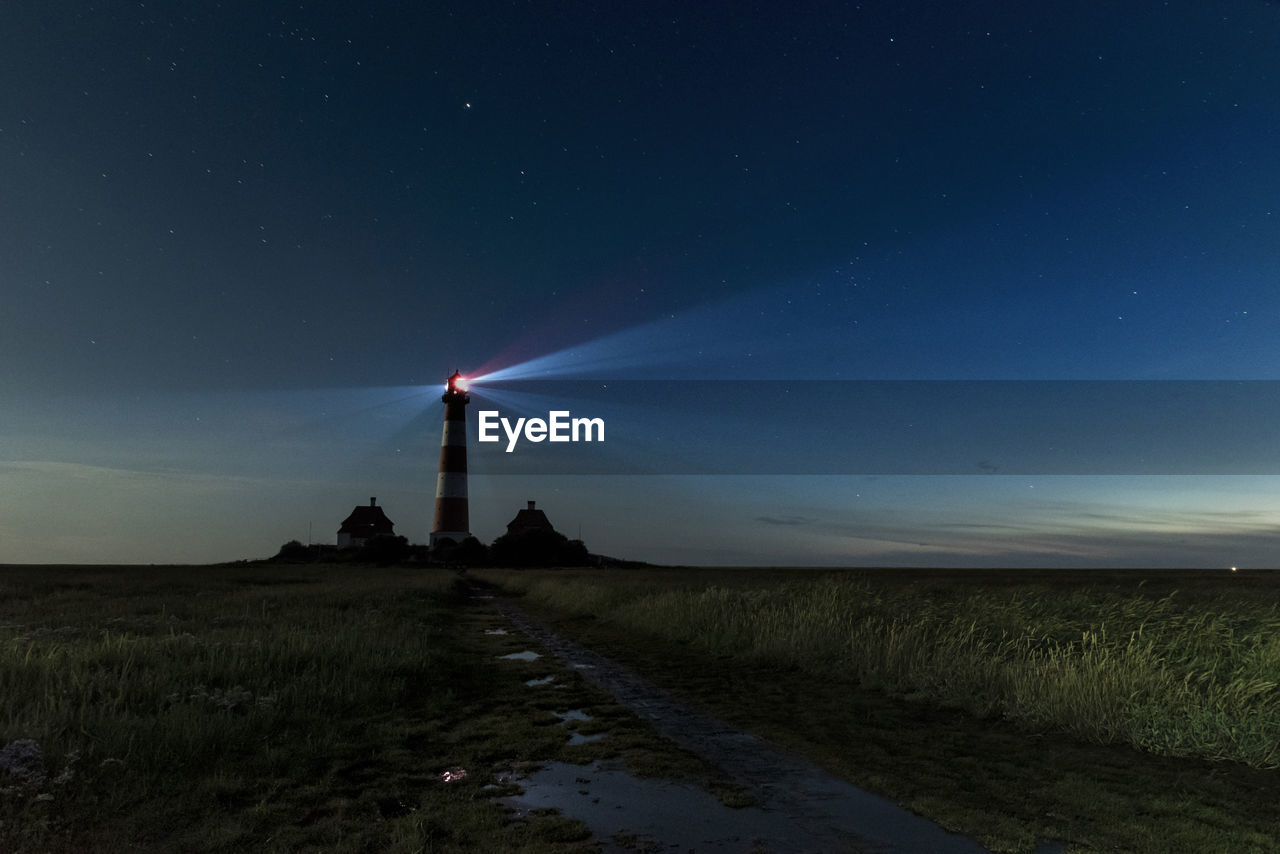 Panoramic view of the lighthouse westerhever at night.