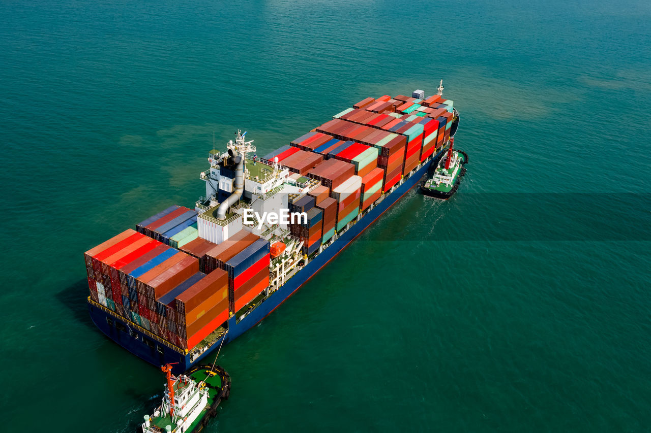 Logistics and transportation of international container cargo ship in the ocean freight aerial view