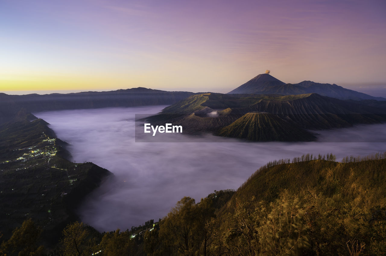 View of volcanic landscape against sky during sunset