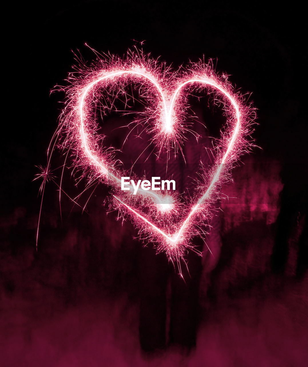 ILLUMINATED FIREWORK DISPLAY AGAINST BLACK BACKGROUND
