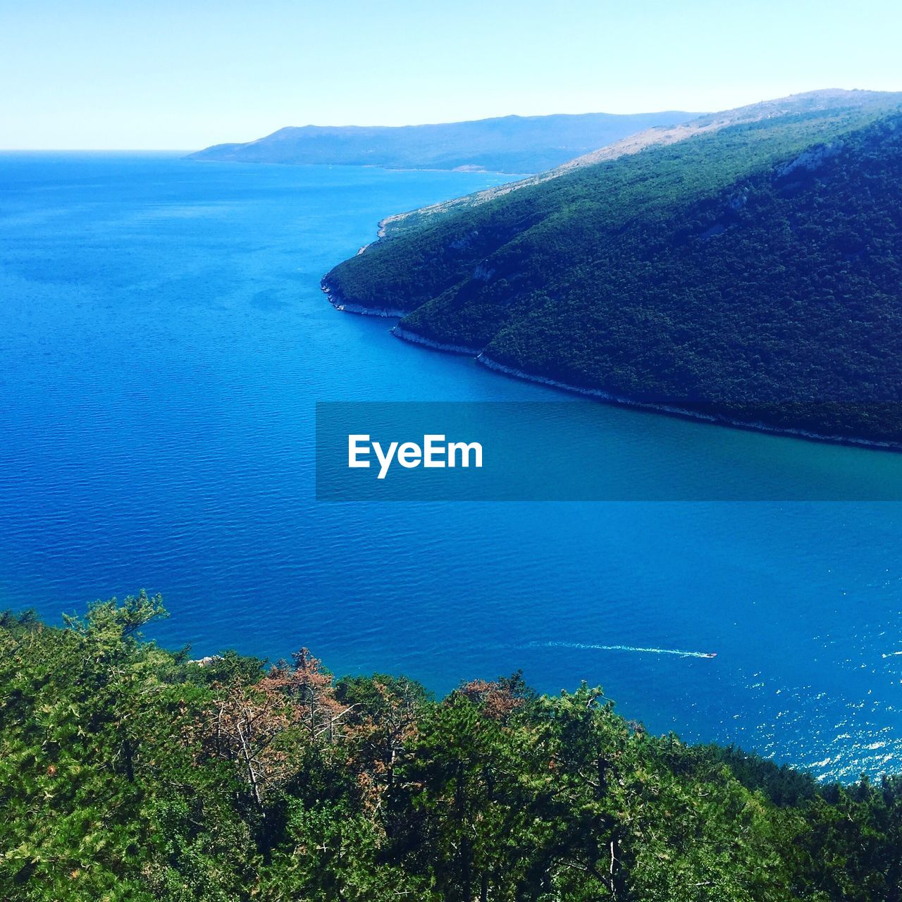 Scenic view of mountains by mediterranean sea