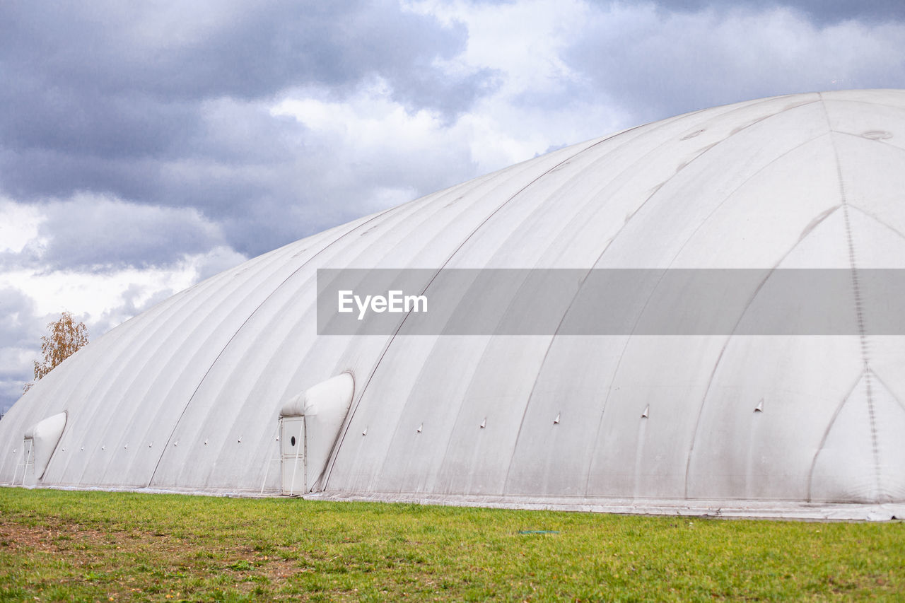 White inflatable hangar. canopy made of tarpaulin. prefabricated sports facilities.