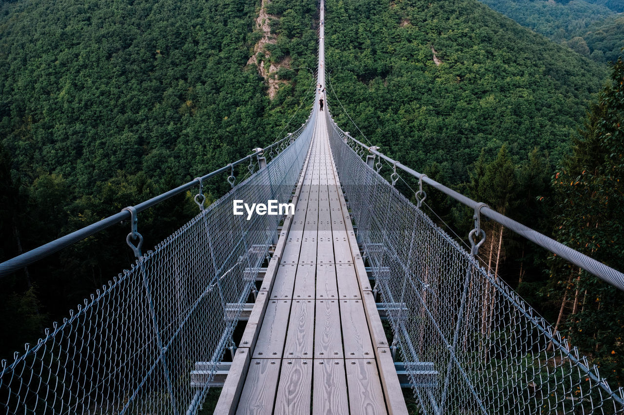High angle view of footbridge over mountains