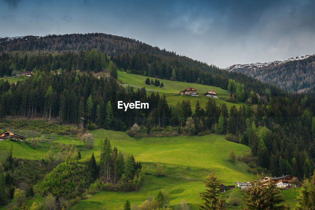 SCENIC VIEW OF LANDSCAPE AND MOUNTAINS AGAINST SKY