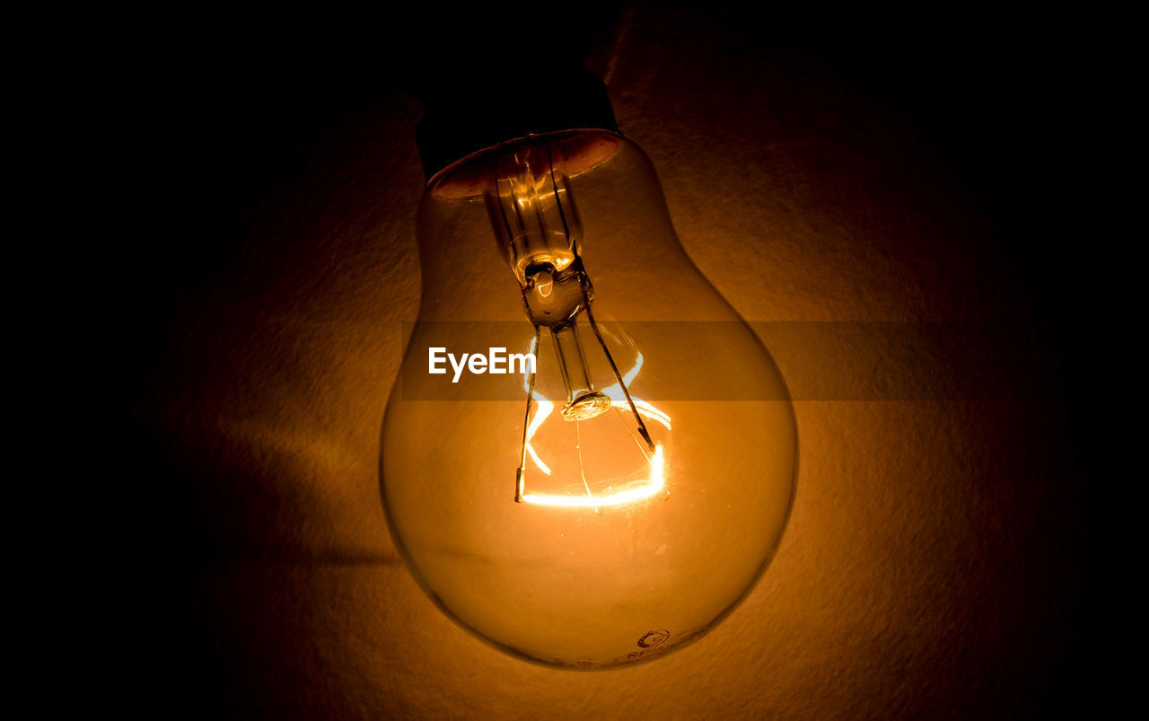 Close-up of illuminated light bulb