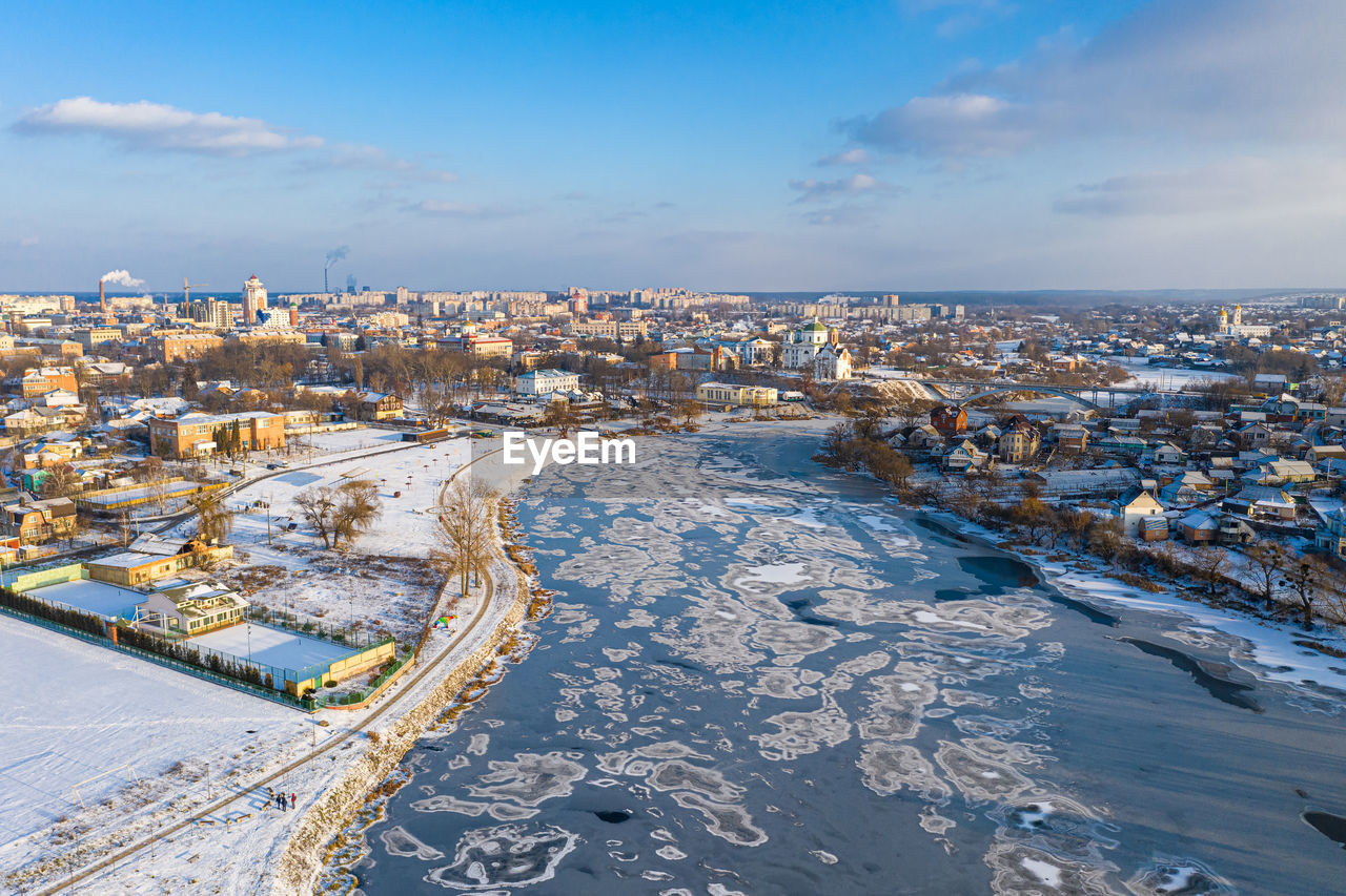 Nice top view of the winter city. bridge over river. orthodox churches and a catholic cathedral.