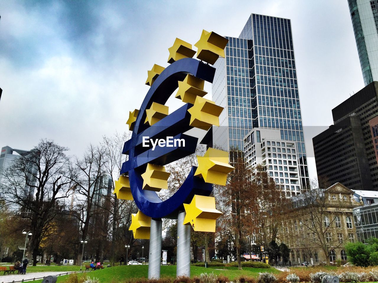 European central bank symbol by buildings against sky