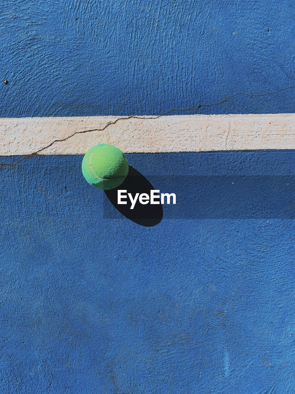 Directly above shot of ball on blue court
