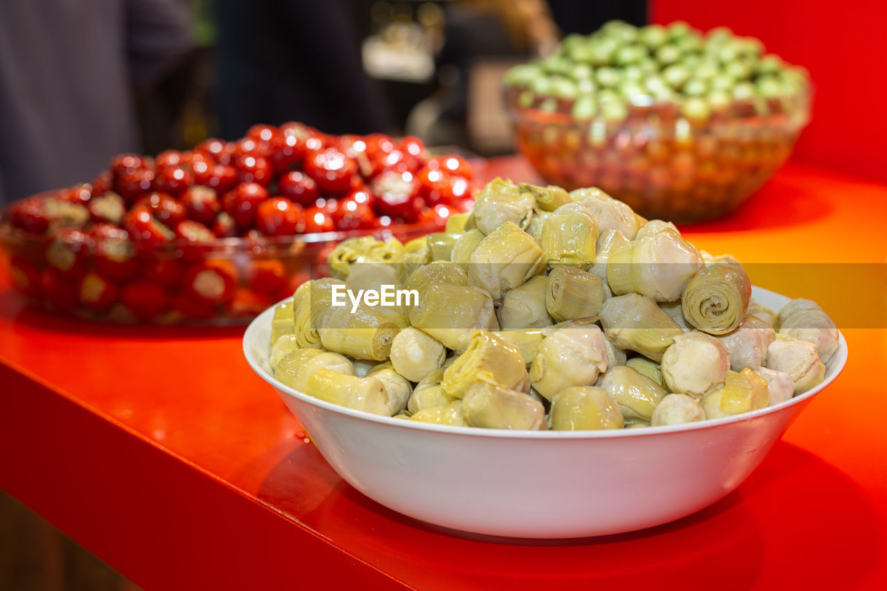 food and drink, food, produce, healthy eating, fruit, red, dish, freshness, wellbeing, bowl, vegetable, plant, meal, abundance, large group of objects, business, market, focus on foreground