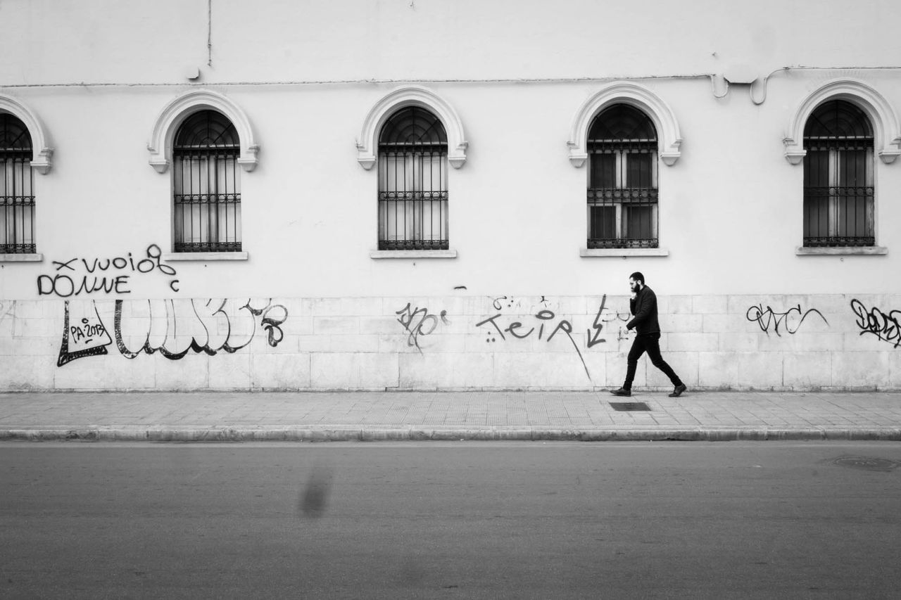 WOMAN WALKING IN CITY