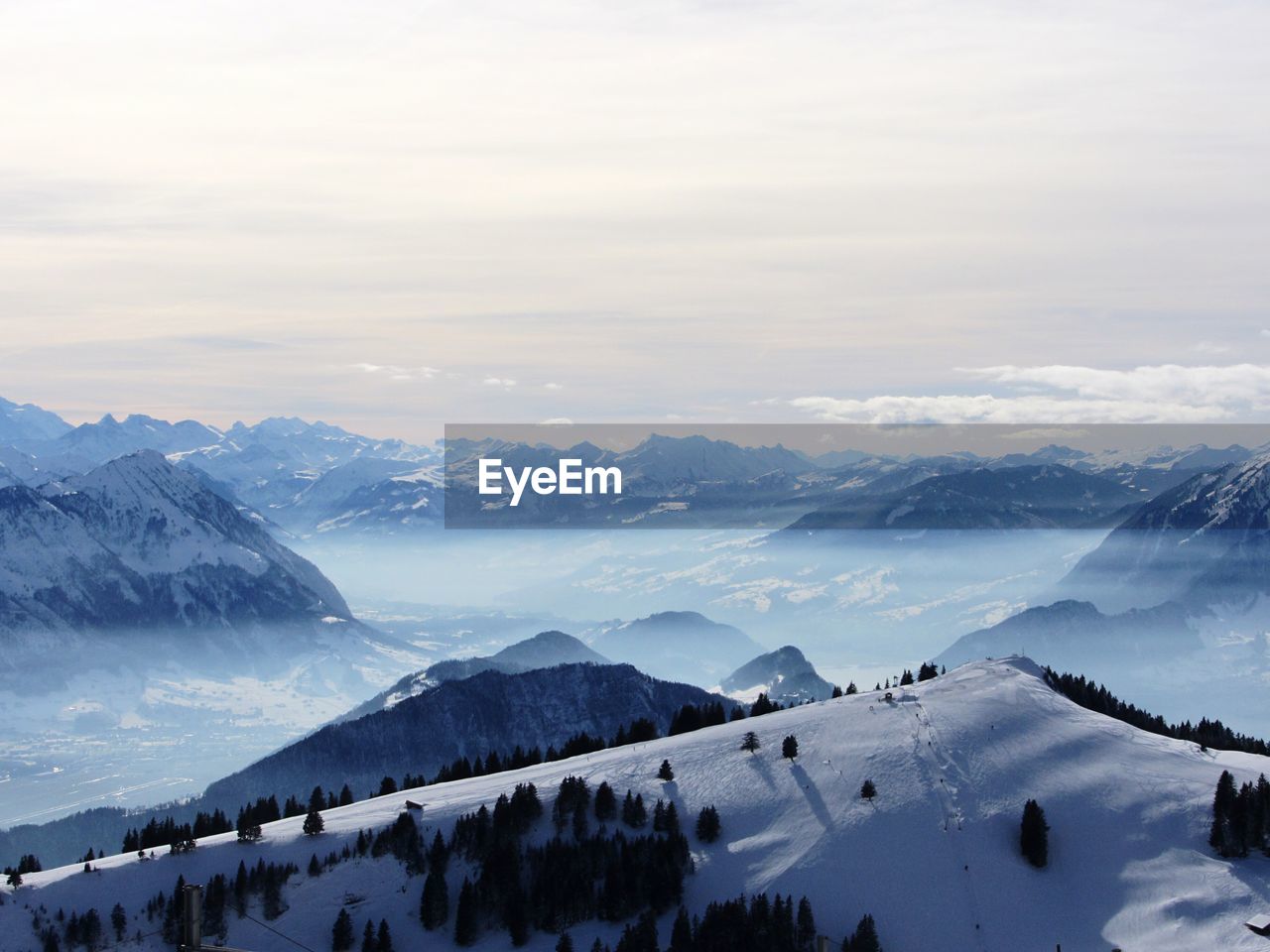 Scenic view of snowy mountain range