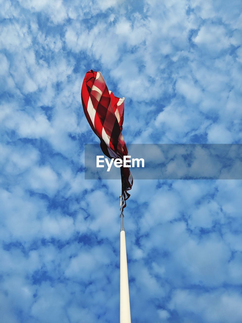 Low angle view of flag against sky