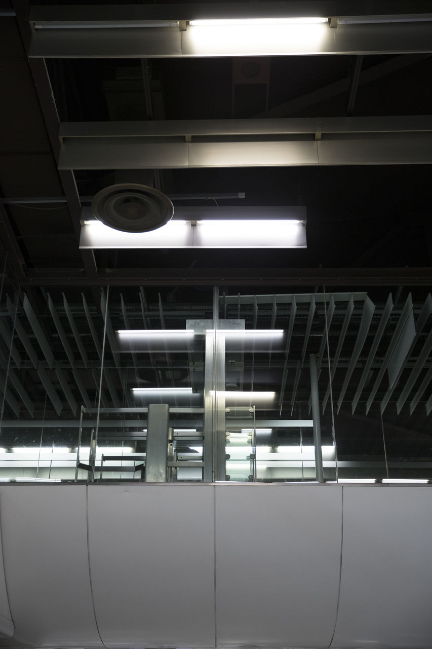 LOW ANGLE VIEW OF ILLUMINATED CEILING IN BUILDING