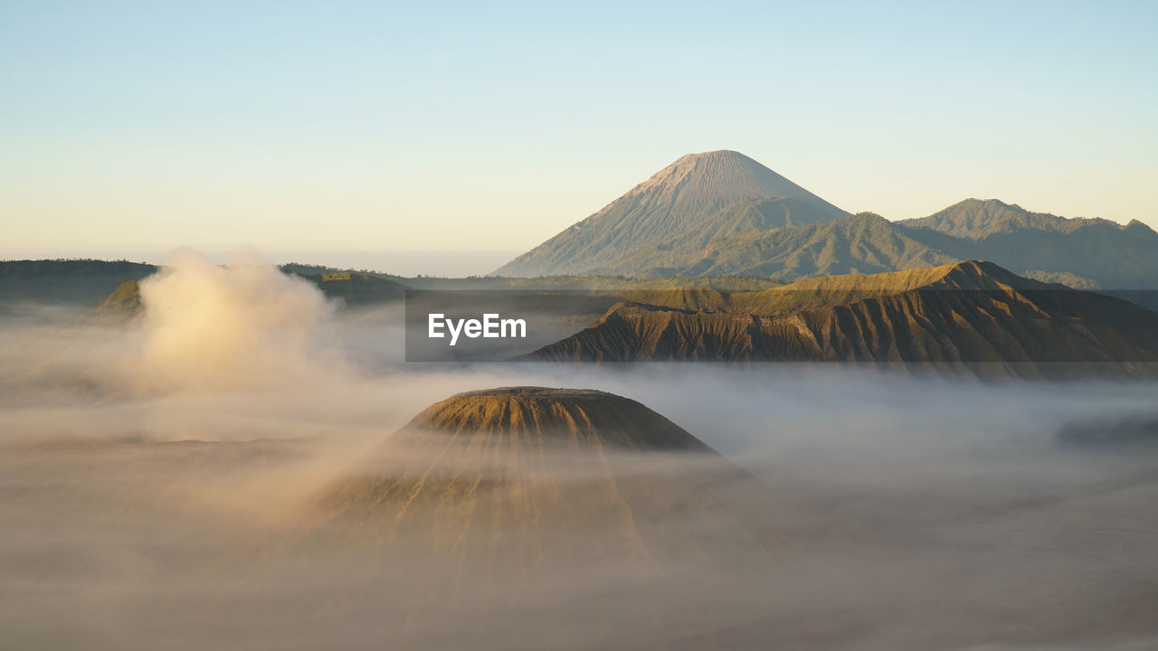 Aerial view of volcanic landscape against sky