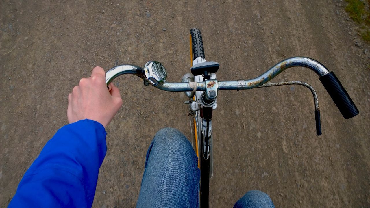 Hand of cyclist on handlebar