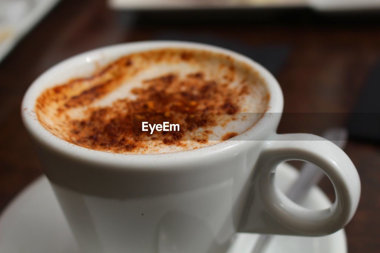 Close-up of cappuccino on table