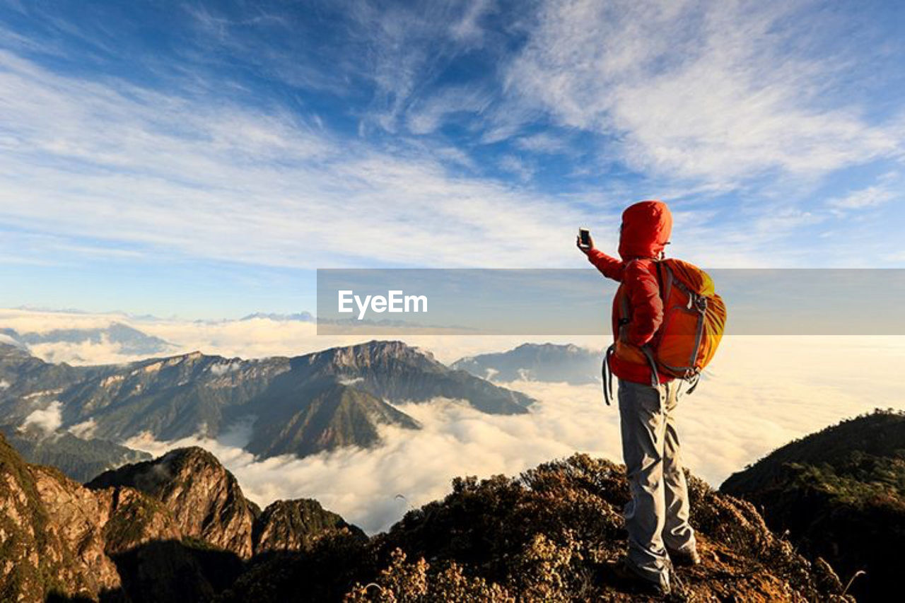 full length of woman standing on mountain