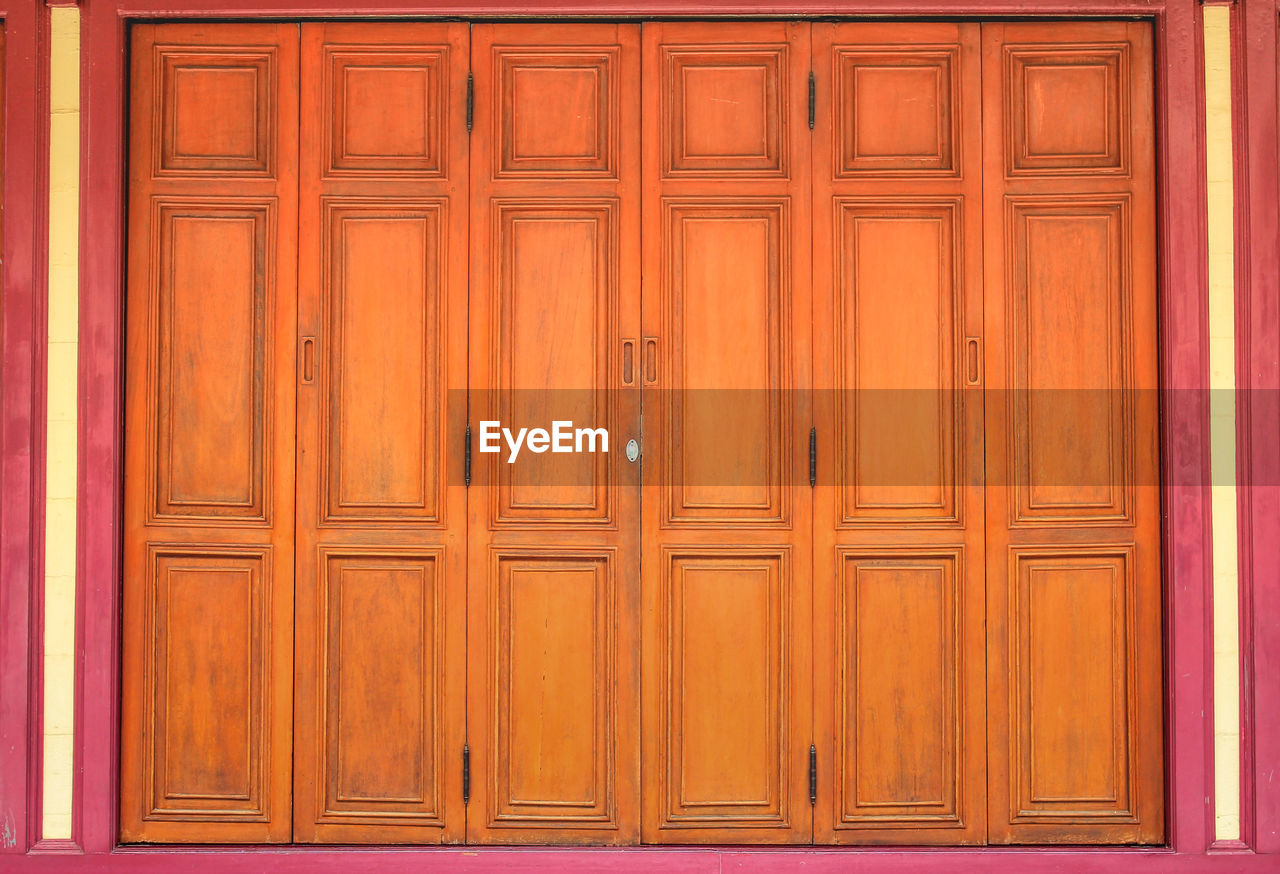 Closed wooden door of building