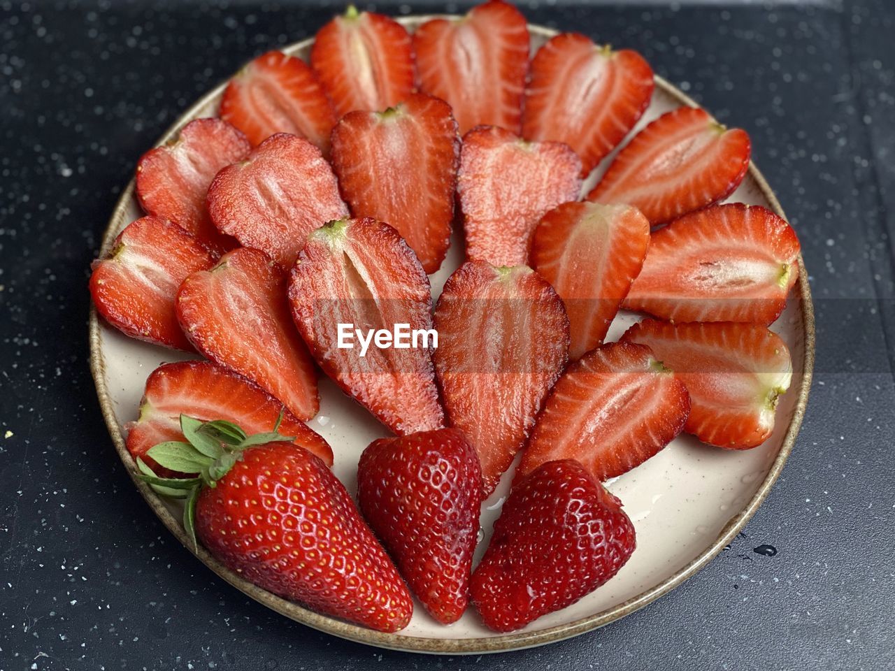 Close-up of strawberries in plate on table