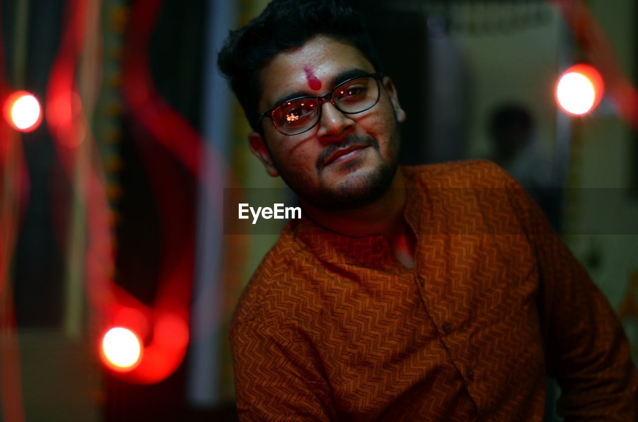 Portrait of young man wearing kurta and eyeglasses