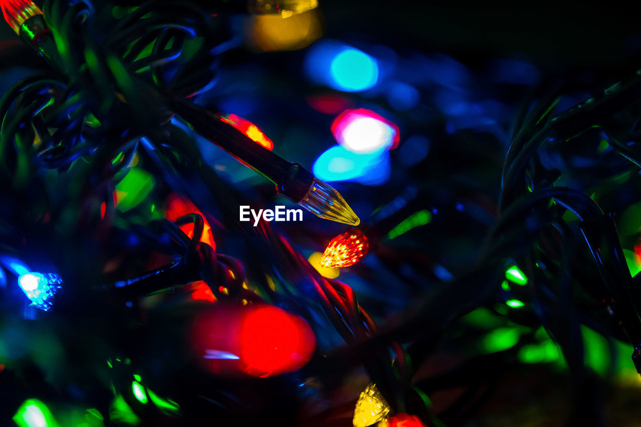 close-up of illuminated christmas tree at night