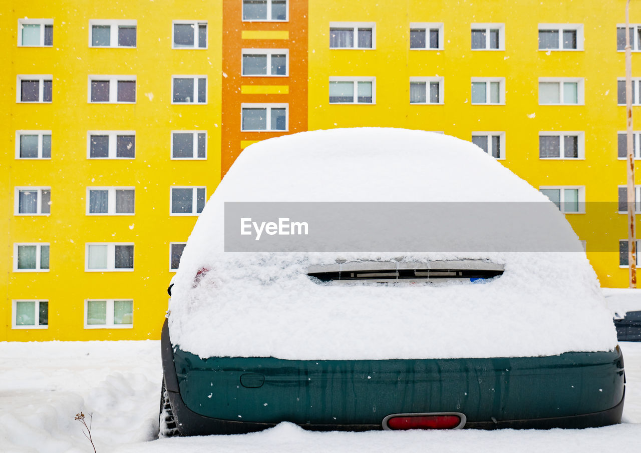 Car lost in snow in winter. cars were covered with snow. concept weather in city