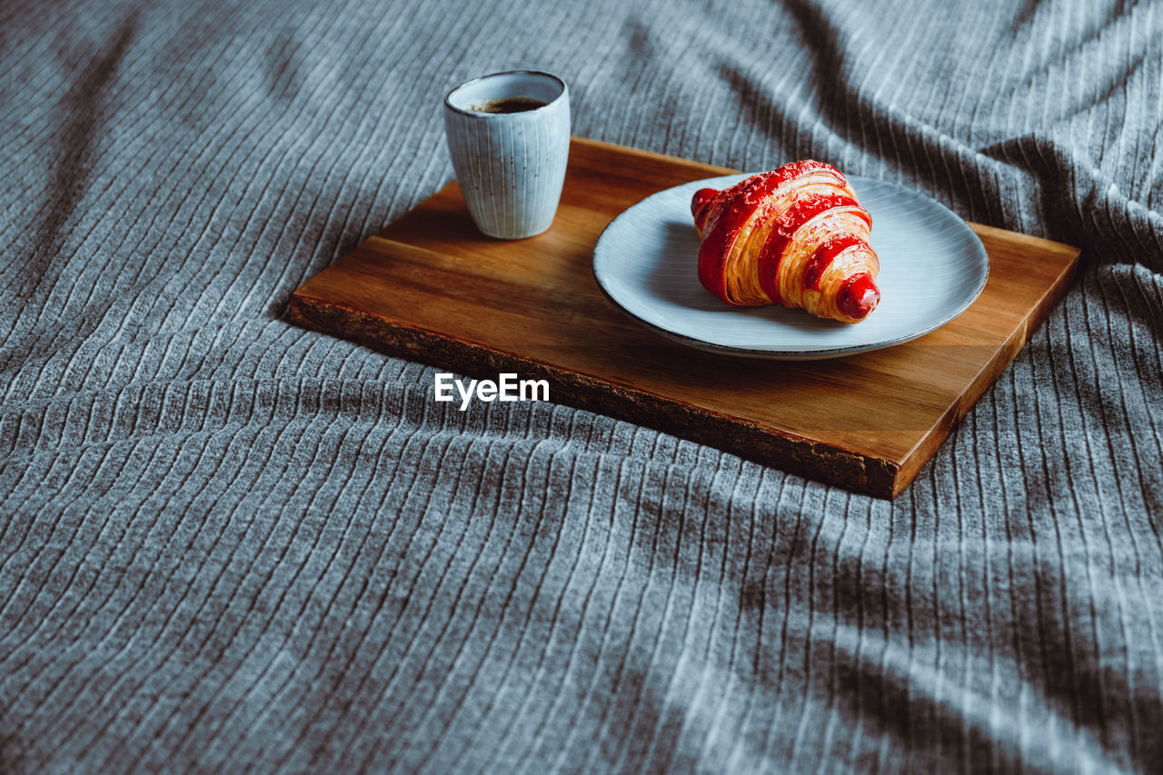 High angle view of breakfast on bed