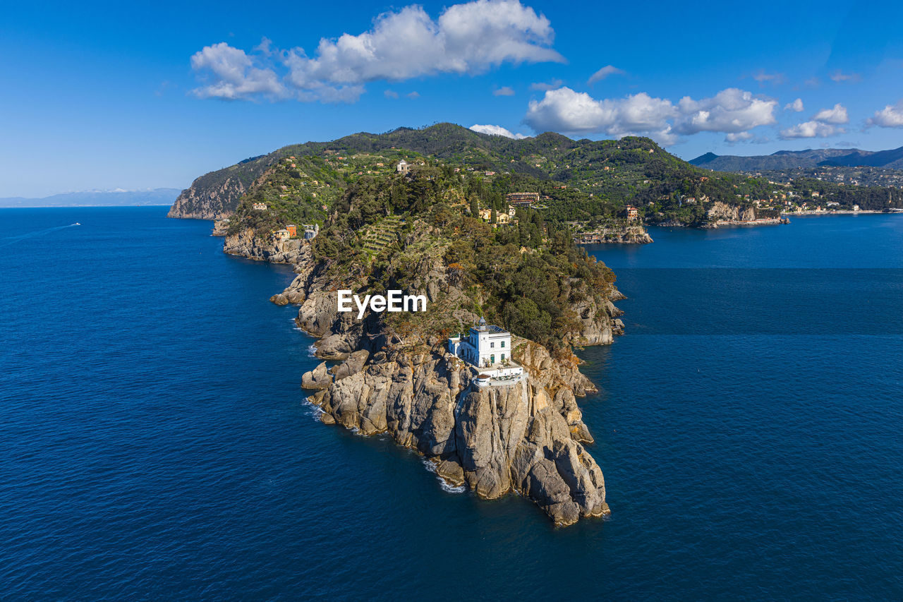 SCENIC VIEW OF SEA AND MOUNTAIN AGAINST SKY