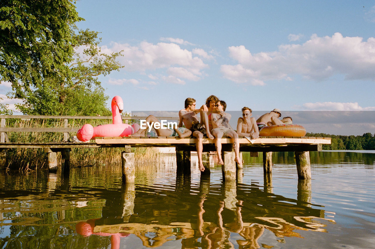 Group of friends enjoying lake