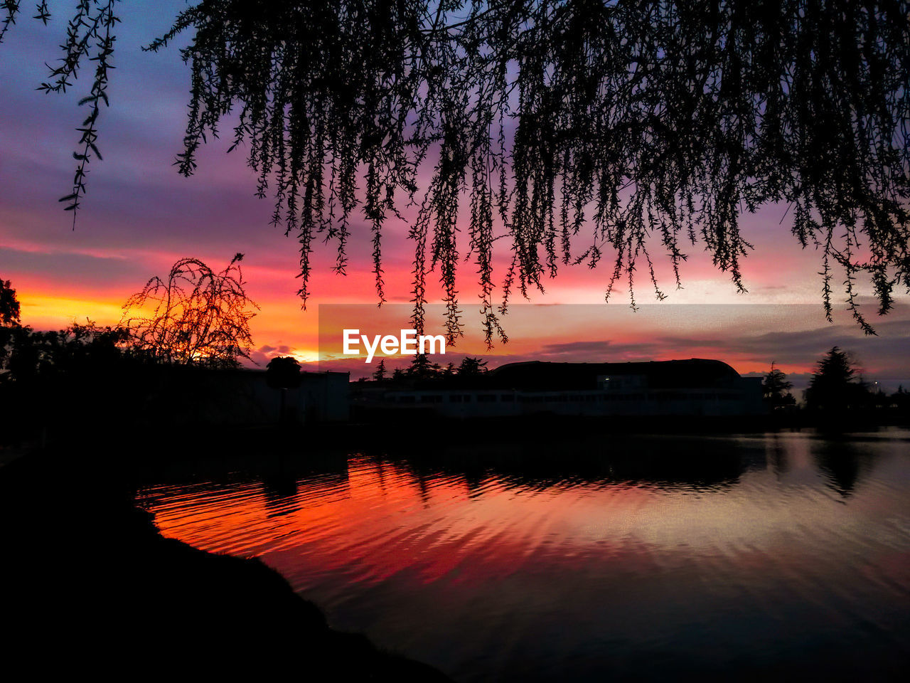 SCENIC VIEW OF LAKE DURING SUNSET