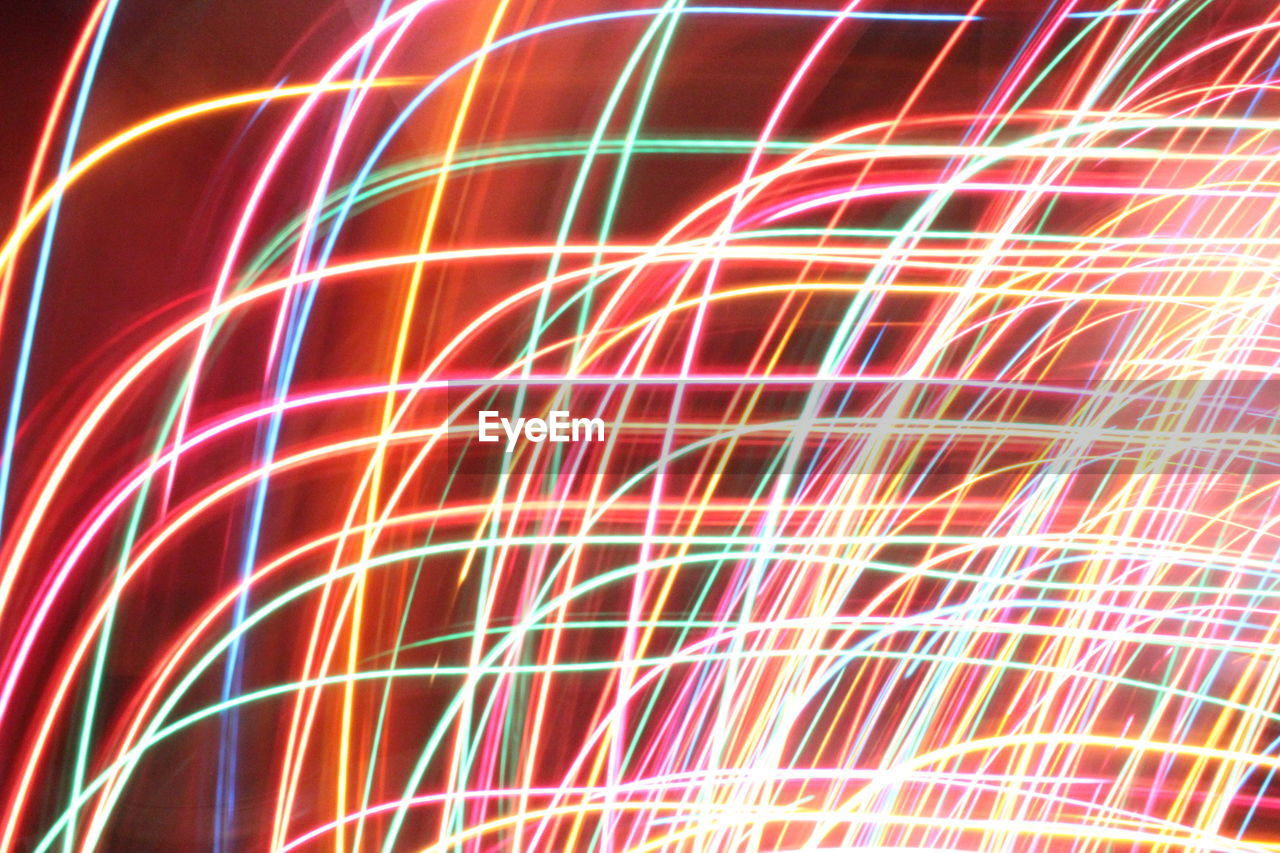 FULL FRAME SHOT OF COLORFUL LIGHT TRAILS