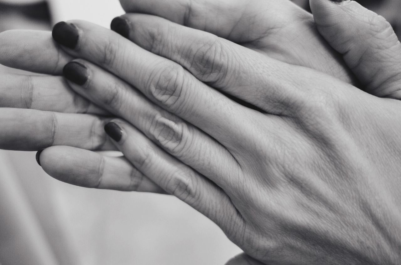 CLOSE-UP OF CROPPED HANDS