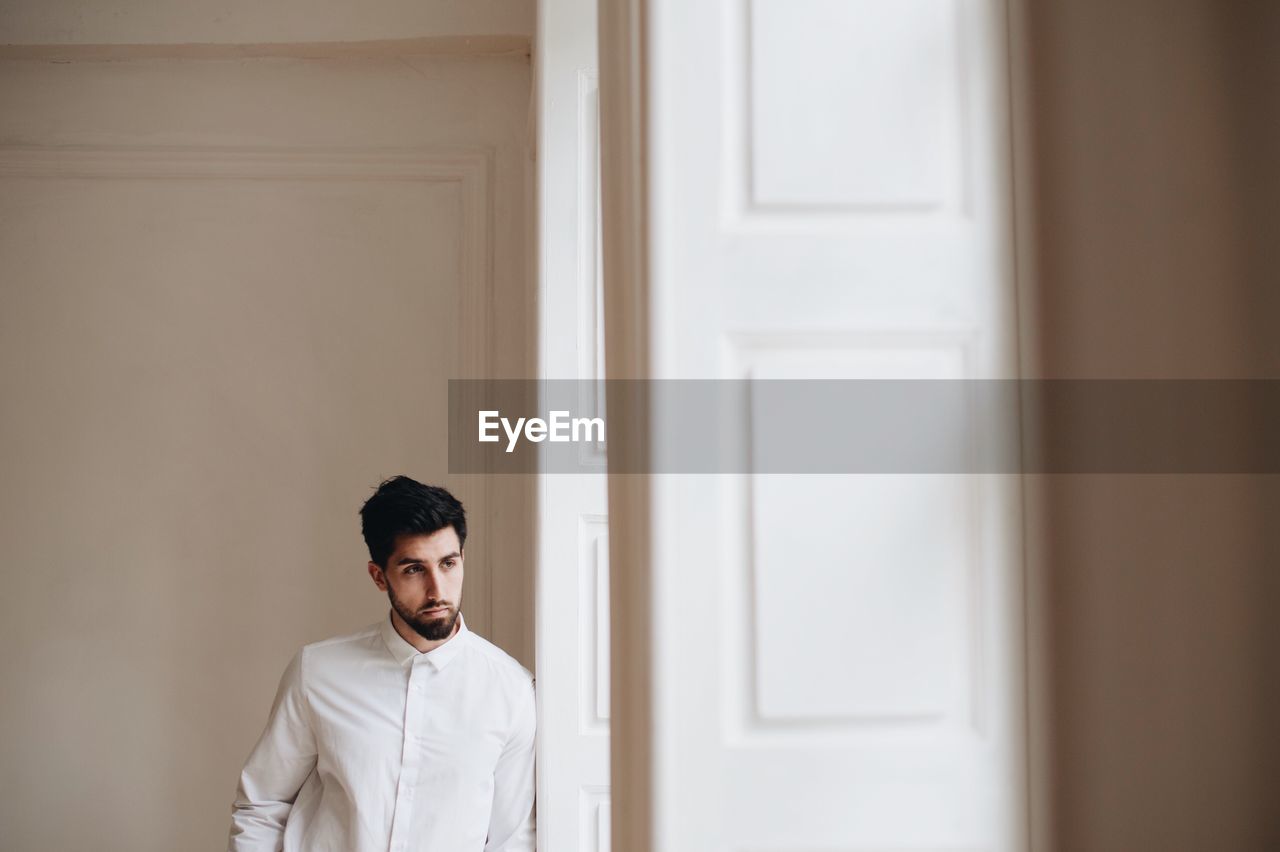 Groom standing by door