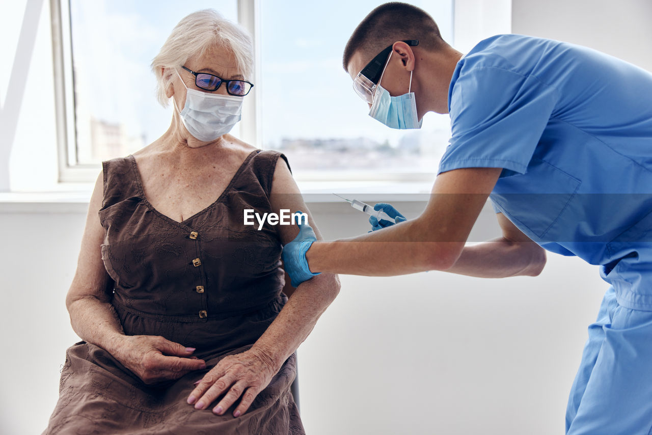 side view of doctor examining patient
