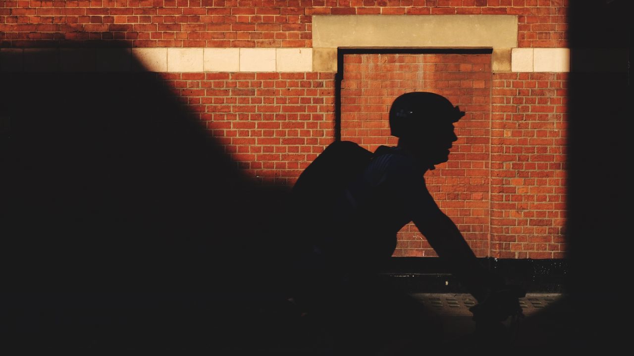 Silhouette of a man cycling