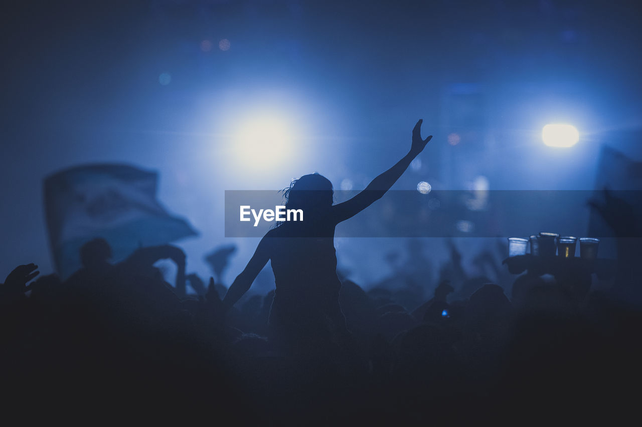 Silhouette of crowd at music festival