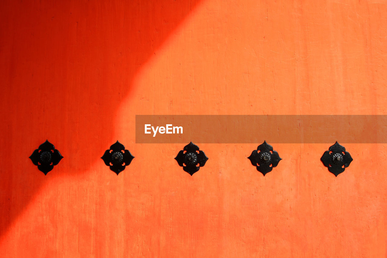 Orange wooden door or wall background with shadow